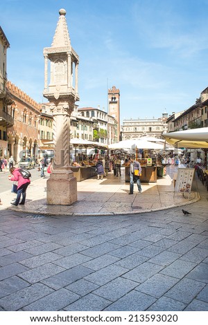 VERONA,ITALY-APRIL 26,2012:tourists and Veronese people in Piazza delle Erbe, the oldest square in Verona during a market day.