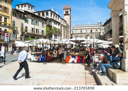 VERONA,ITALY-APRIL 26,2012:people and tourists strolling in the day market in the \