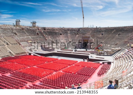 VERONA,ITALY-APRIL 26,2012:people and tourist stroll inside the famous roman arena located in the city of verona durin a sunny day.