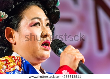 PADOVA,ITALY-DECEMBER 8,2014:An oriental singer artist with traditional costumes during a perform inside an event called Festival of East which takes place in the Italian city of Padua