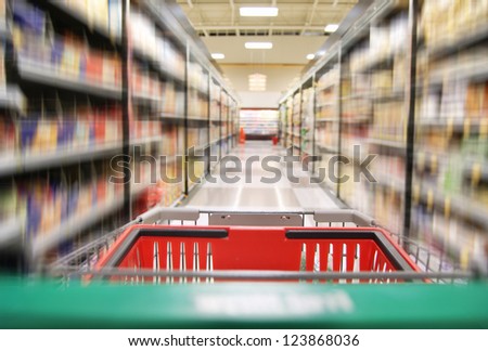 an aisle in a grocery store showing cereals and canned food