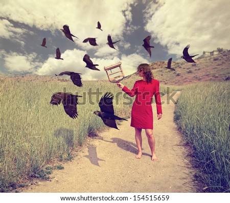 a girl walking through a field with a flock of ravens or crows toned with a retro vintage instagram filter effect action app