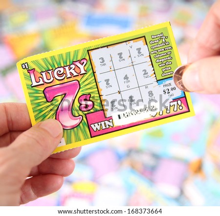 Boise, Idaho - December 21, 2013: A Lucky 7 Scratch Ticket Being Played In Hopes Of Winning A Cash Prize