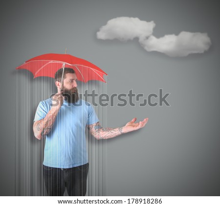 a man getting rained on under an umbrella