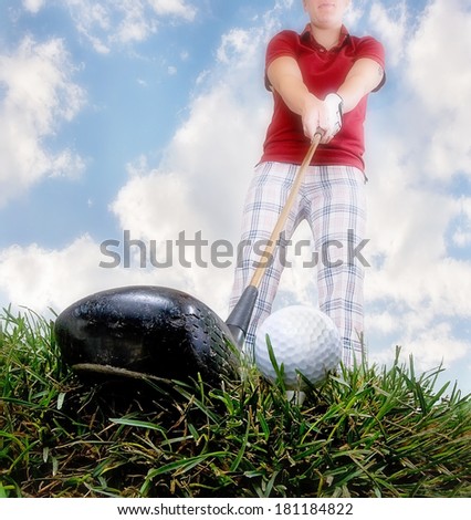 a person playing golf as seen through a wide angle lens