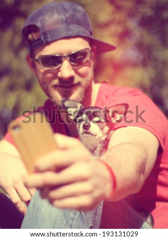 a cute guy smiling at the camera on a bright sunny day done with a retro vintage instagram filter