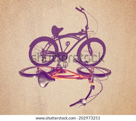 a cruiser bicycle with a shadow shot straight on with an instagram like filter added