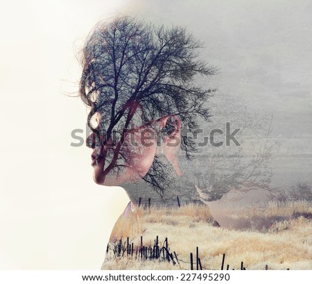 a serious looking woman side profile toned with vintage tones for a retro look and a double exposure with a field and trees