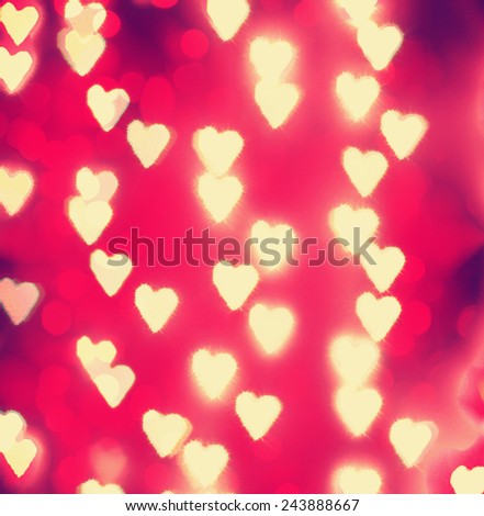 a nice background with unfocussed lights blurred into the shape of hearts - holidays like valentine\'s day or wedding announcements or romantic cards toned with a retro vintage instagram filter effect