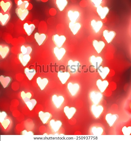 a nice background with defocused lights blurred into the shape of hearts good for holidays like valentine\'s day or wedding announcements or romantic cards