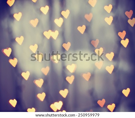 a nice background with defocused lights blurred into the shape of hearts good for holidays like valentine\'s day or wedding announcements or romantic cards