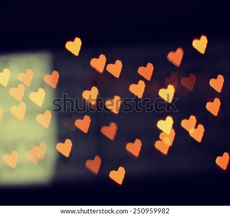 a nice background with defocused lights blurred into the shape of hearts good for holidays like valentine's day or wedding announcements or romantic cards