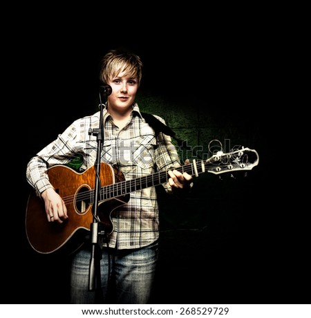a cute musician playing a solo show with a black background