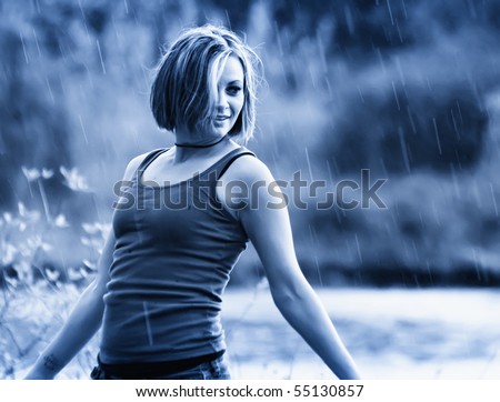 a pretty girl caught in a rain shower