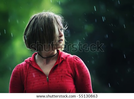 a pretty girl caught in a rain storm