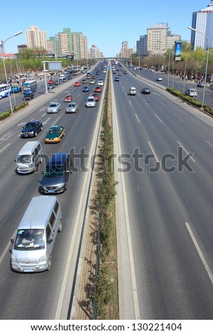 BEIJING - APRIL 10: Sunny day without traffic in Beijing\'s highway on April 10, 2011 in Beijing, China.Beijing has expected to pass the five million vehicles on its roads by the end of the 2012.