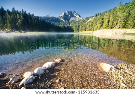 Reflection in smooth water of mountain lakes