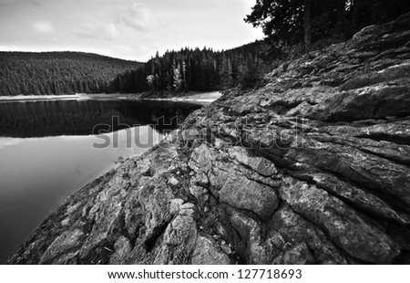 Rocks to lake the mountain black and white