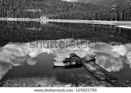 Lake and boats in mountain black and white