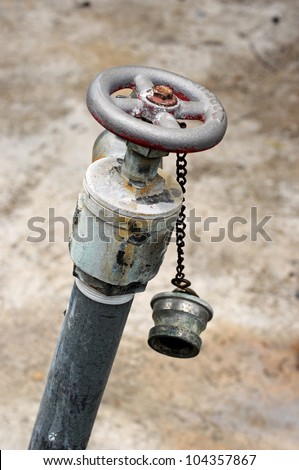 Old tap with rusty mug - water supply shortage
