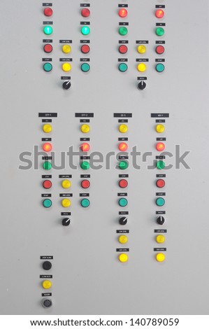 Closeup of electrical board with lamps and switches