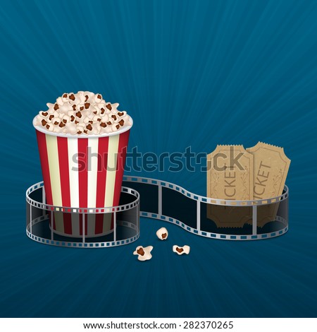 Popcorn and filmstrip with vintage ticket on blue background