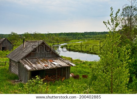 Russian rural bath on the bank of small river