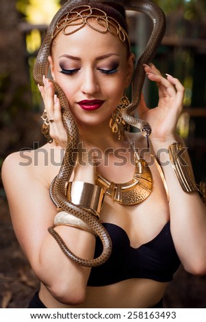 Beautiful girl and snake at tropical island - Hainan