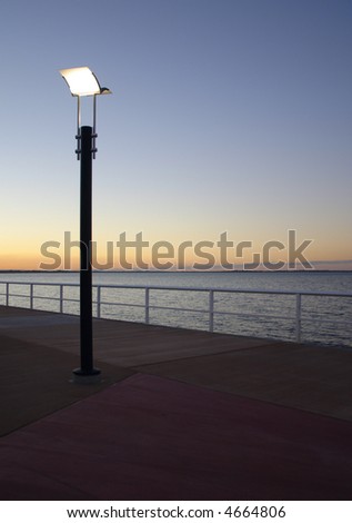 sunset along a boardwalk