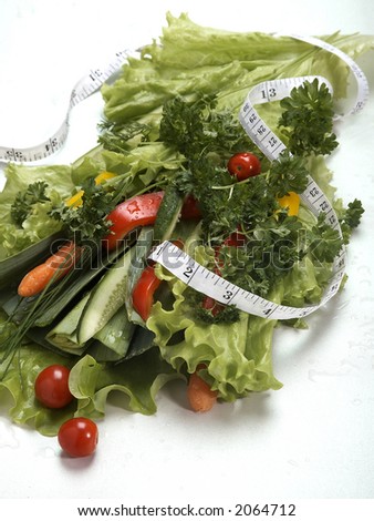 salad bouquet with measuring tape on white isolated background