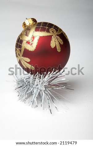 christmas ball with silver tinsel on white background