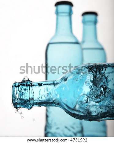 sparkling water in blue bottles