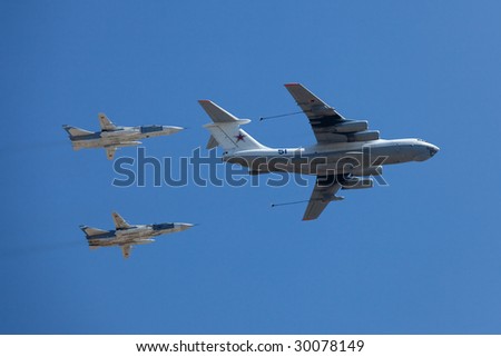MOSCOW - MAY 9 : Russian Air Force airplanes (four-engined aerial refueling tanker Il-78 and attack aircrafts Su-24) imitate aerial refueling at  Moscow Victory Parade May 9, 2009 in Moscow.