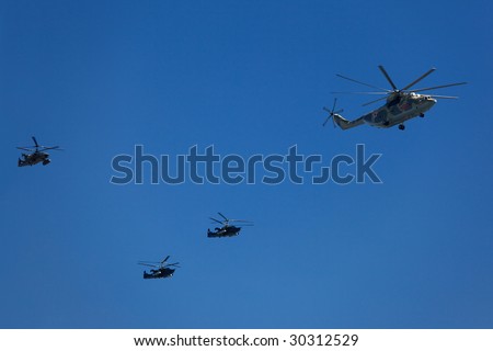 MOSCOW - May 9: Russian Air Force helicopters (heavy transport helicopter Mi-26, attack helicopters Ka-50 Black Shark and Ka-52 Alligator) at Victory Parade on May 9, 2009.