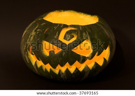 Jack-o\'-lantern, spooky Halloween green pumpkin face.