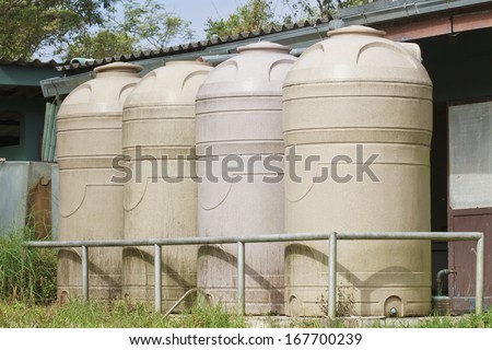Cream water tank on the underfoot in park