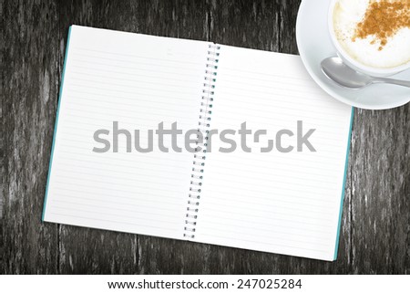 Blank book with coffee on the wooden table