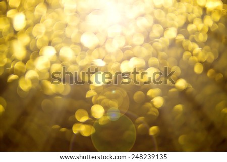 Bokeh of gold mirror with light from the light and sun