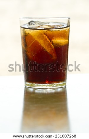 Soft drinks in a glass with ice for a refreshing drink