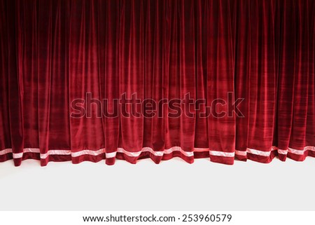 Red closed velvet curtain in a theater
