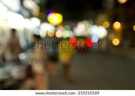 Blurred tourists walking on the street at night on Koh Samui, Chaweng Beach, Surat Thani, Thailand