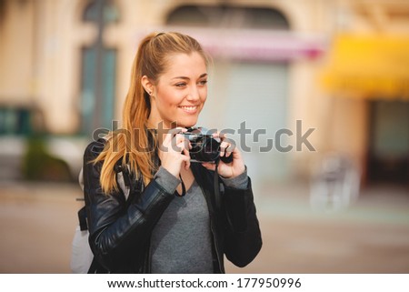 Tourist woman sited taking pictures