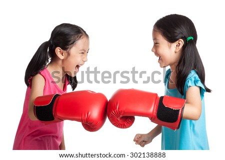 Happy Asian twins girls  with boxing gloves  isolated on white background
