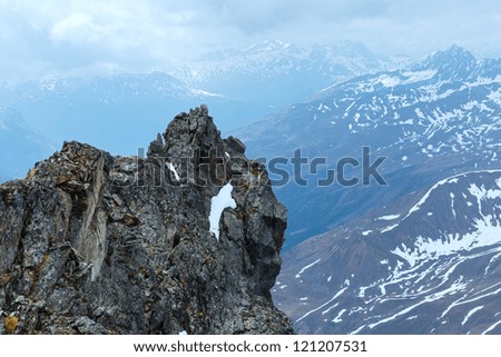 Overcast mountain view with stony rock above precipice (near Kaunertal Gletscher on Austria-Italy border)