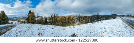 October Carpathian mountain panorama with first winter snow on dirty road. Four shots composite picture.