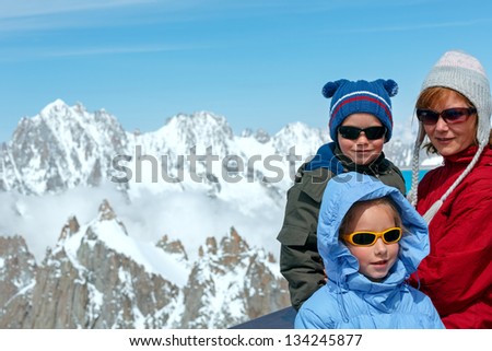 Family on observation area and Mont Blanc mountain massif behind (view from Aiguille du Midi Mount,  France )
