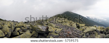 stones and clouds in Gorgany region of Carpathian mountains (Ukraine), and distant birds in sky. Six shots composite picture.
