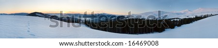 Mountain ridge sunrise panorama view with moon and sun (Drahobrat Ski Resort, Yasenja village, Zacarpatsjka Region, Carpathian Mt\'s, Ukraine). Twelve shots stitch image.