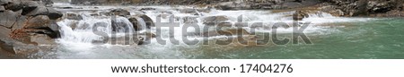 Panorama view of autumn mountain river with waterfall. Six shots composite picture.