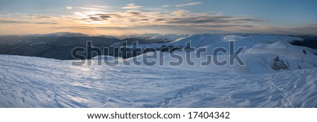 Beautiful mountain sunset landscape with sun way on ice-coated mountainside. (Ukraine, Carpathian Mt's, Svydovets Range) Three shots stitch image.